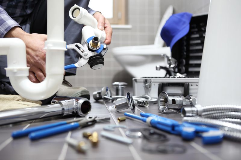 Plumber Repairing Pipe